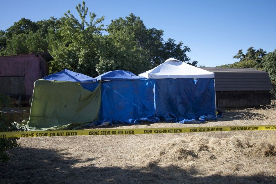  Tents installed by local police surround sheds on the property next door to the home of Garrido in Antioch