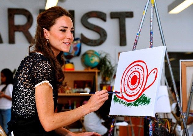 Britains Catherine, the Duchess of Cambridge, does a painting during a visit to the Inner-City Arts club in Los Angeles 