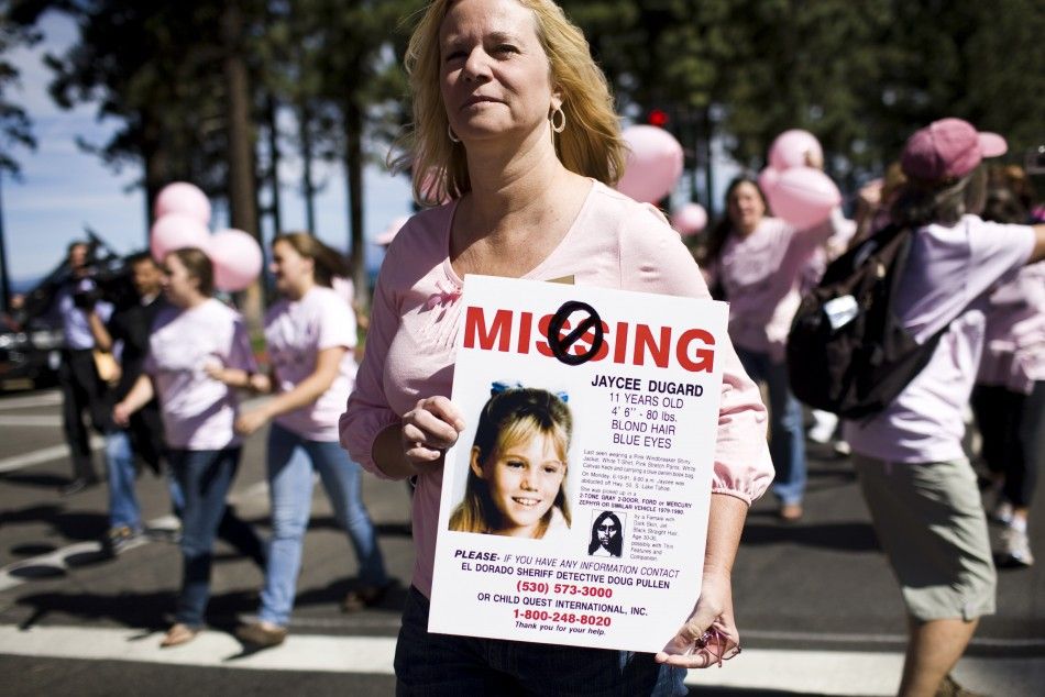 Laurie Ault holds a sign used to publicize the disappearance of Jaycee Dugard during a parade through South Lake Tahoe celebrating the reappearance of Jaycee Dugard