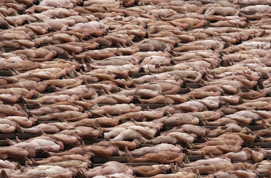 Naked volunteers pose for U.S. artist Tunick in front of the Sydney Opera House