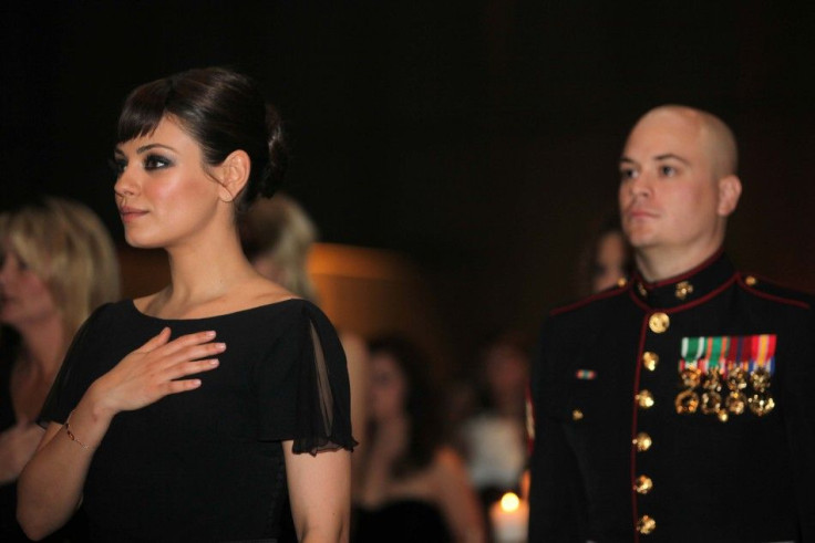 Sergeant Moore and actress Kunis, stand during national anthem 236th Marine Corps birthday ball for 3rd Battalion, 2nd Marine Regiment, 2nd Marine Division in Greenville