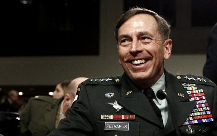 U.S. General David Petraeus smiles as he prepares to testify at his Senate Armed Services Committee confirmation hearing to become commander of U.S. forces in Afghanistan on Capitol Hill in Washington June 29, 2010
