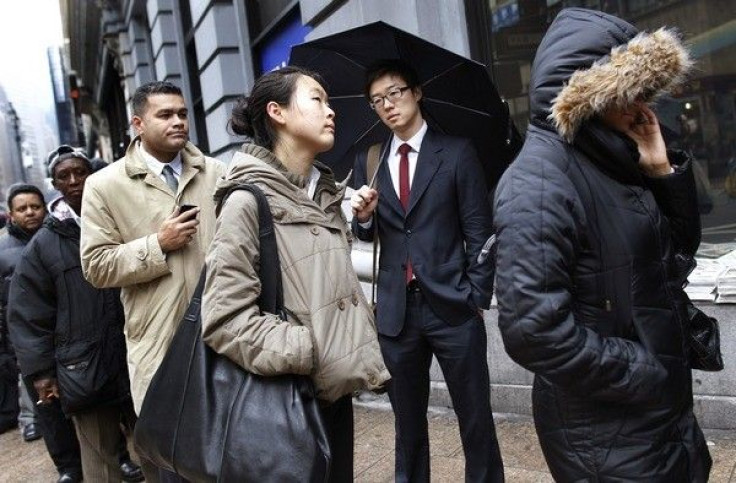 People wait in line to enter the NYCHires Job Fair in New York, February 24, 2010.