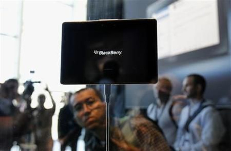 Conference attendees look over the new Blackberry PlayBook at the Research in Motion Blackberry developers conference in San Francisco