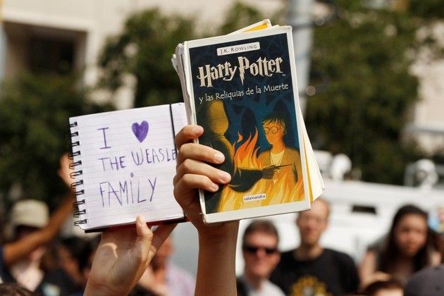 Harry Potter fans hold up mementos at the premiere of the film quotHarry Potter and the Deathly Hallows Part 2quot in New York 