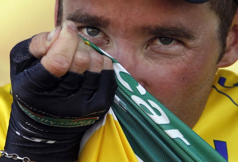 Europcar rider Thomas Voeckler of France kisses the yellow jersey