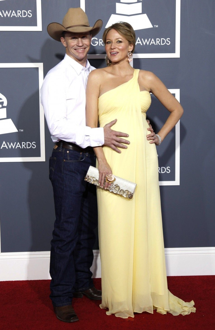 Pregnant Jewel and Ty Murray pose on arrival at the 53rd annual Grammy Awards.