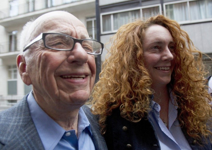 News Corporation CEO Rupert Murdoch leaves his flat with Rebekah Brooks, Chief Executive of News International, in central London