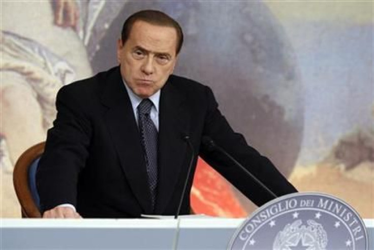 Italian Prime Minister Silvio Berlusconi looks on during a news conference at Chigi palace in Rome