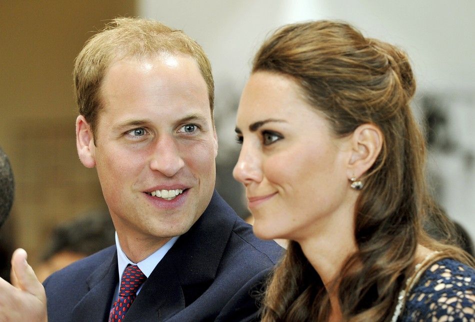 Britain039s Prince William looks at his wife, Catherine, the Duchess of Cambridge
