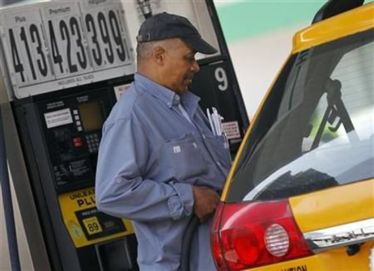 A taxicab driver fills his tank at a gas station in Midtown Manhattan