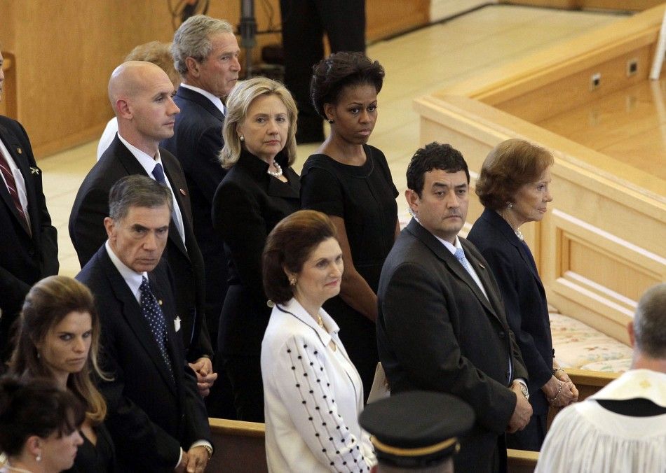 Nancy Reagan, George W. Bush, Hillary Clinton, Michelle Obama and Rosalynn Carter watch as members of the armed forces carry the coffin bearing the body of Betty Ford into St. Margarets Episcopal Church