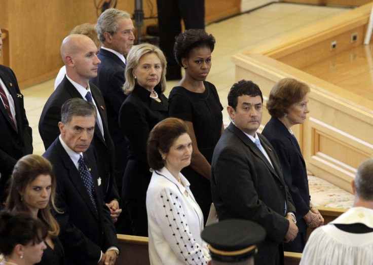 Nancy Reagan, George W. Bush, Hillary Clinton, Michelle Obama and Rosalynn Carter watch as members of the armed forces carry the coffin bearing the body of Betty Ford into St. Margaret's Episcopal Church