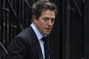 British actor Hugh Grant arrives at the Leveson Inquiry at the High Court in central London, November 21, 2011.