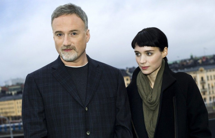 Actress Rooney Mara and director David Fincher pose during a press meeting in Stockholm, November 21, 2011. Mara is starring as Lisbeth Salander in the movie &#039;The Girl with the Dragon Tattoo&#039; which has its premiere in Stockholm on December 13.