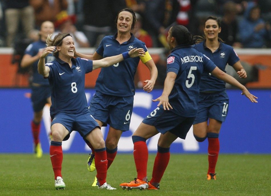 Frances Bompastor celebrates with teammates her goal against the U.S. during their Womens World Cup semi-final soccer match in Monchengladbach