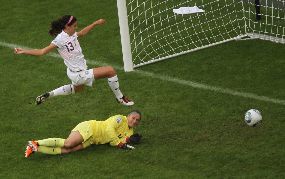 Morgan of the U.S. challenges Frances goalkeeper Sapowicz during the Womens World Cup semi-final soccer match against France in Monchengladbach