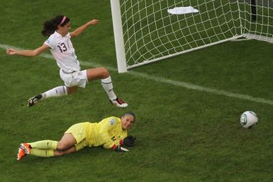 Morgan of the U.S. challenges France's goalkeeper Sapowicz during the Women's World Cup semi-final soccer match against France in Monchengladbach