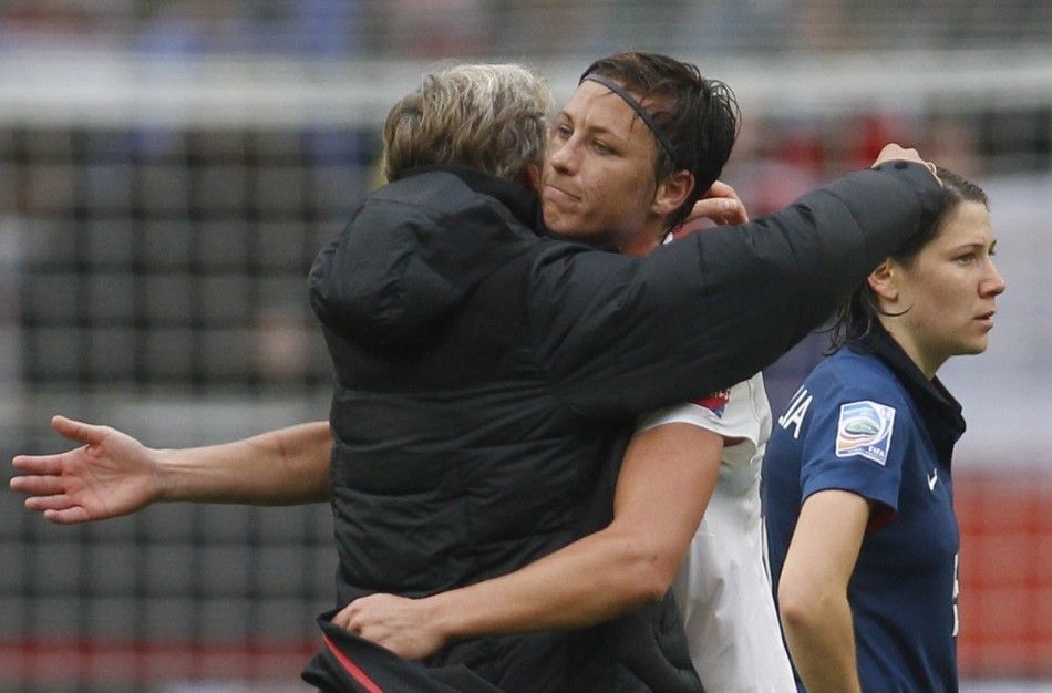 The coach Sundhage and Wambach of the U.S. celebrate victory after the Womens World Cup semi-final soccer match against France in Monchengladbach