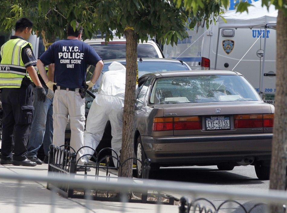 NYPD crime scene investigators inspect the car of the suspected killer of Kletzky outside his home in the Orthodox Jewish section of Borough Park