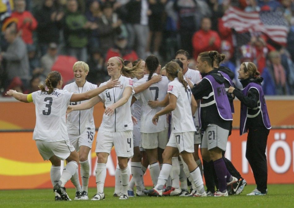 Players of the U.S. celebrate victory after the Womens World Cup semi-final soccer match against France in Moenchengladbach
