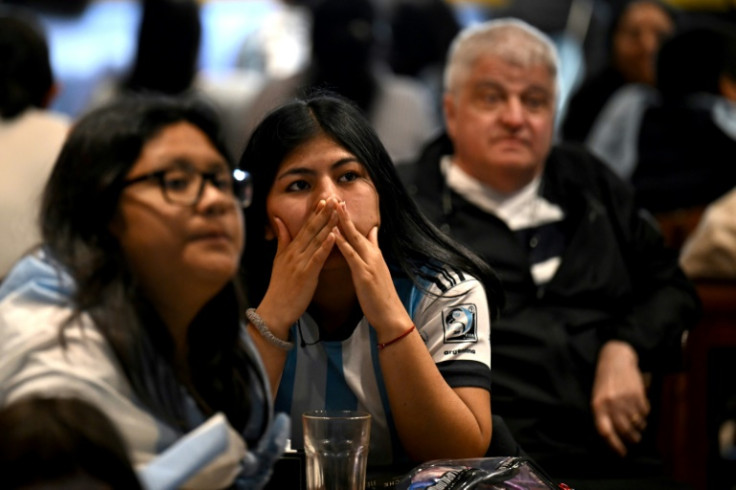 Stunned Argentina fans watch their team's shock loss to Saudia Arabia during the World Cup in Qatar