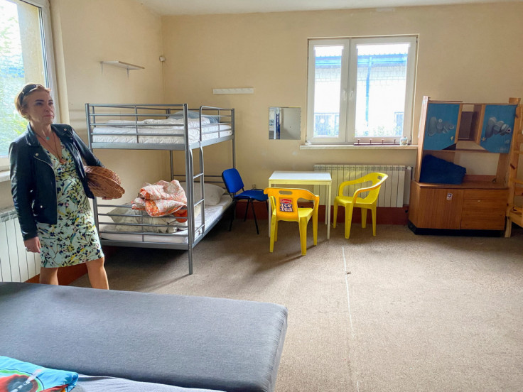 Gynecologist Agnieszka Kurczuk points to where Ukrainian refugees she treated were staying in a hostel in Piaseczno, Poland