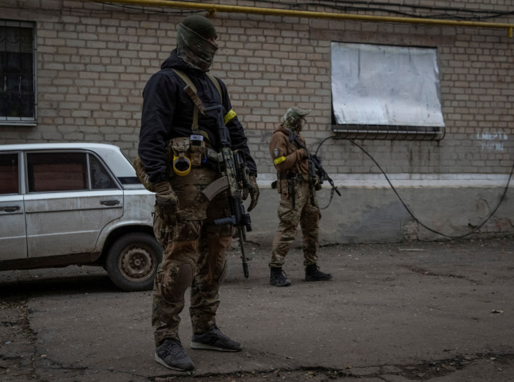 Members of pro-Ukrainian Chechen battalion check an area in the town of Bakhmut