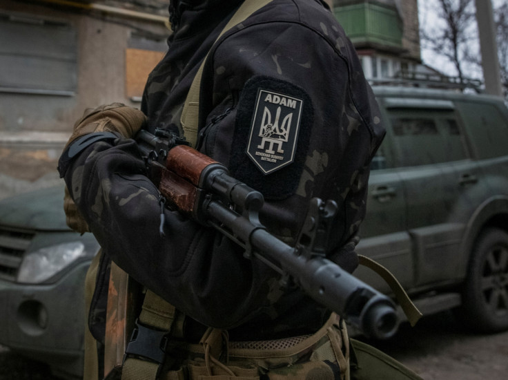 Member of pro-Ukrainian Chechen battalion holds his weapon in the town of Bakhmut