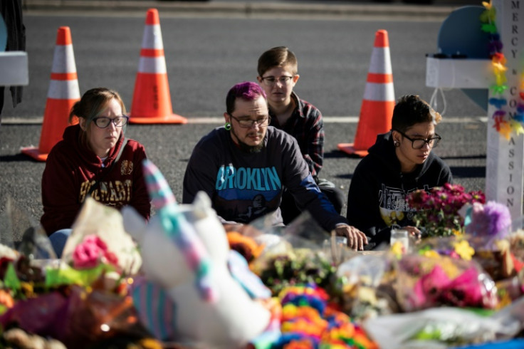 Mourners gather outside of Club Q in Colorado Springs, Colorado, on November 22, 2022, three days after a shooter opened fire in the club