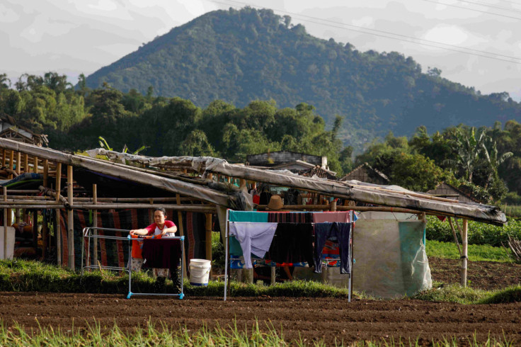 A local hangs laundry on clotheslines at a makeshift tent after Monday's earthquake hit Cianjur