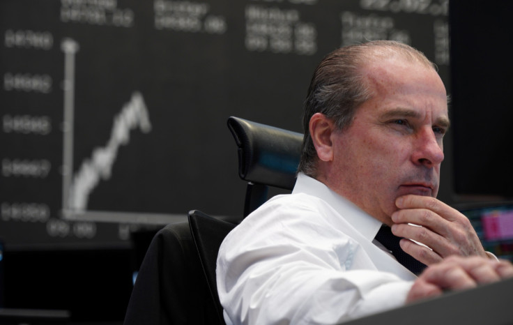 A trader works at the Frankfurt stock exchange in Frankfurt