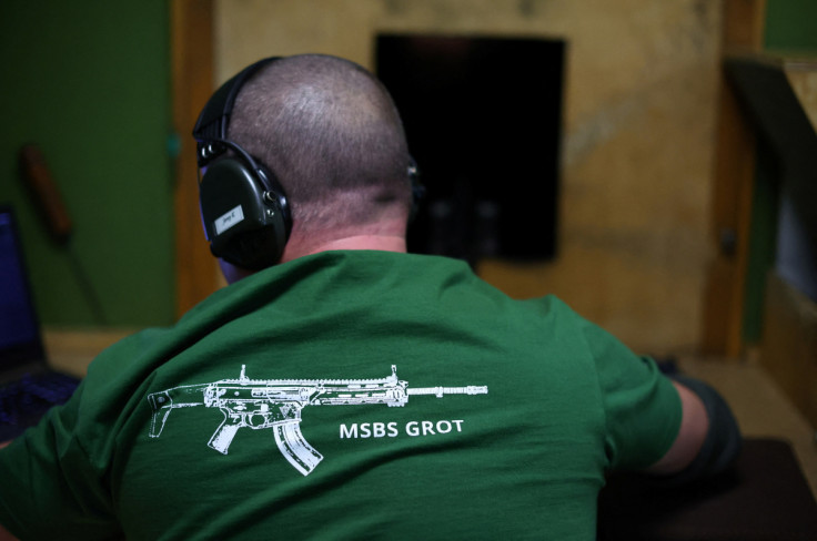 A worker checks the quality of firing of GROT C16 FB-M1, modular assault rifle system at arms factory Fabryka Broni Lucznik in Radom