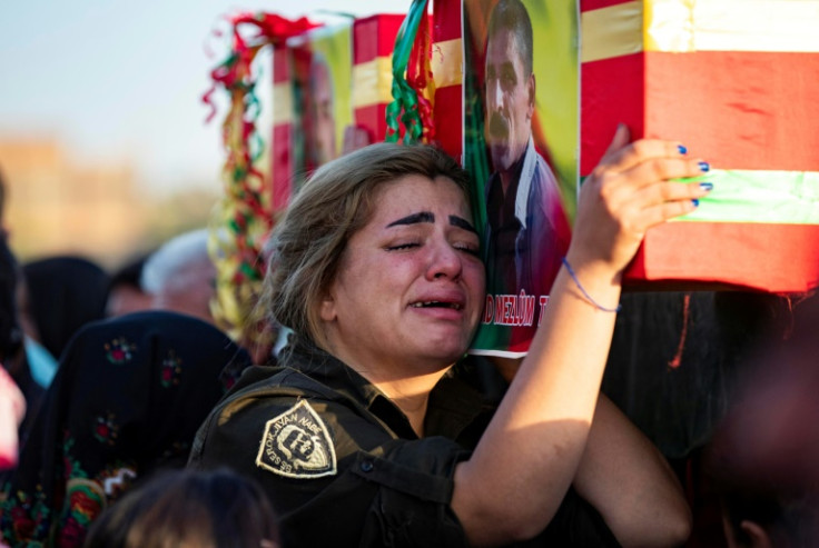 A mourner in the funeral procession of two civilians, sympathisers of the Syrian Democratic Forces (SDF), killed in a Turkish drone attack in Syria's northeastern Kurdish-majority city of Qamishli, on October 29, 2022