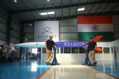 Pawan Chandana and Bharath Daka pose for a photograph with a mockup of Vikram-S rocket in Hyderabad