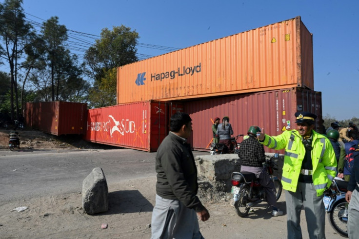 Police used shipping containers to block roads leading to the capital