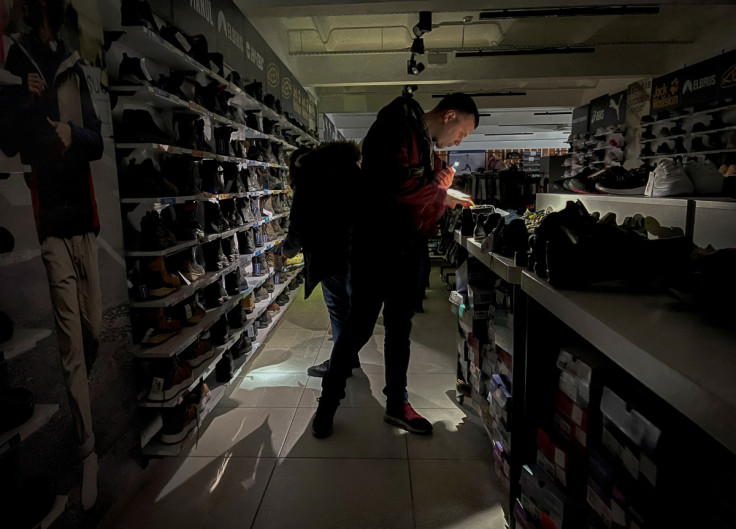 People visit store during power outage in Kyiv