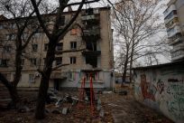 View shows an apartment building damaged by a recent Russian military strike in Kherson