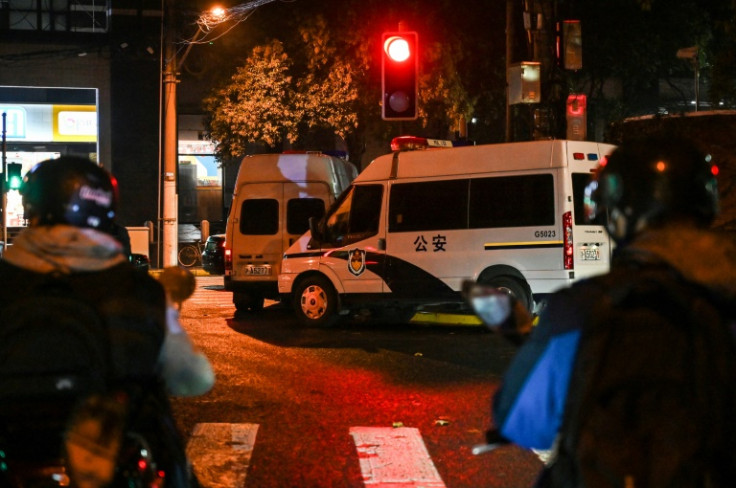 Police cars are seen on a street in Shanghai