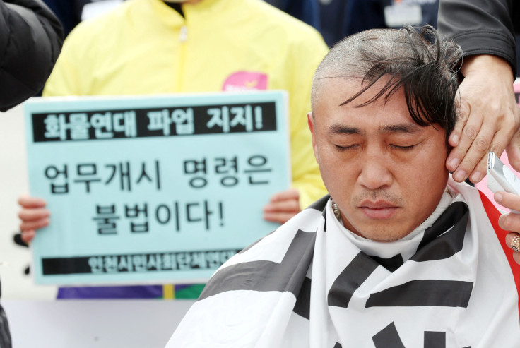 Unionised truck driver has his hair shaved at a head-shaving protest to oppose President Yoon Suk-yeol issuing a back-to-work order for protesting truckers in Incheon