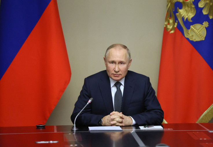 Russian President Vladimir Putin chairs a meeting with members of the Security Council in Moscow Region