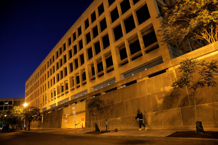 A person walks by the Department of Labor headquarters in Washington, D.C.
