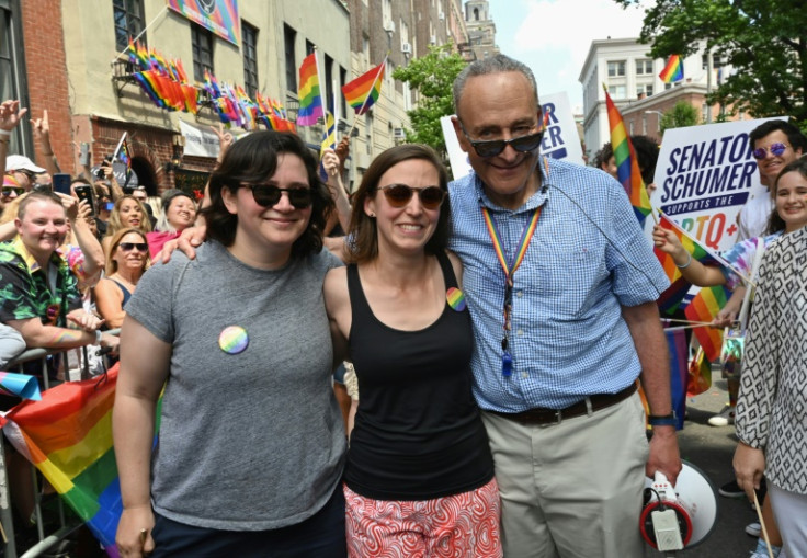 US Senate Democratic leader Chuck Schumer is seen with his daughter Alison (far left) during a gay pride march in New York on June 30, 2019
