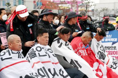 Unionised truck drivers have their hair shaved at a head-shaving protest to oppose President Yoon Suk-yeol issuing a back-to-work order protesting truckers in Incheon