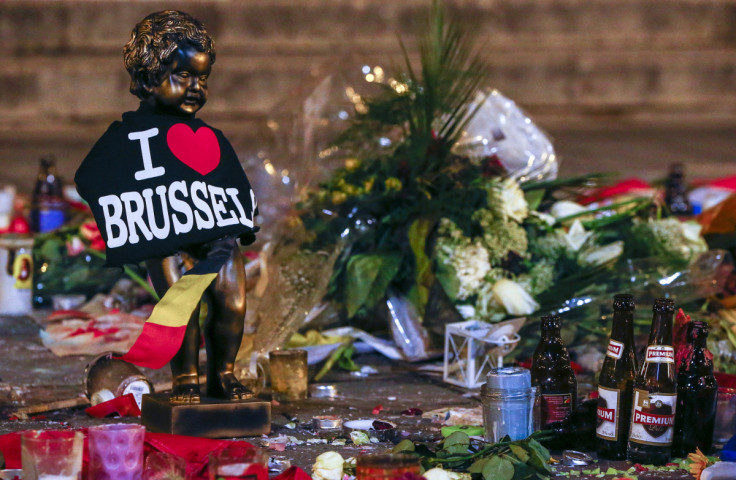 A replica of the Manneken-Pis statue, a major Brussels tourist attraction, is seen among flowers at a memorial for the victims of bomb attacks in Brussels metro and Brussels international airport of Zaventem, in Brussels