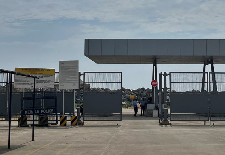 Private security guards stand near an entrance of the proposed Vizhinjam Port