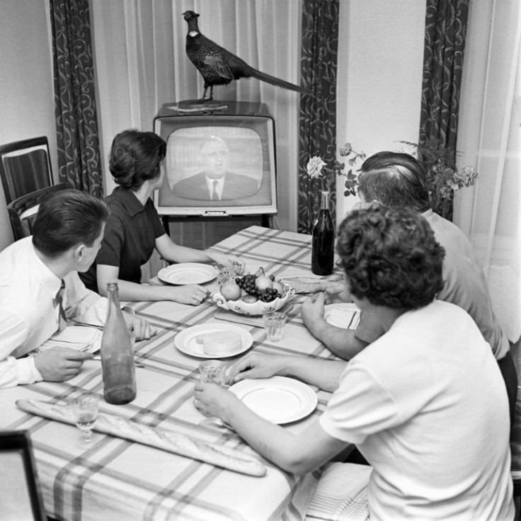 Table staple: a French family watches a speech by President Charles de Gaulle in 1961, by which time the baguette accompanied most meals