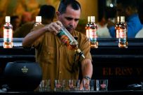 A bartender serves the new Havana Club Cuban Spiced rum at Havana's rum museum on November 15, 2022