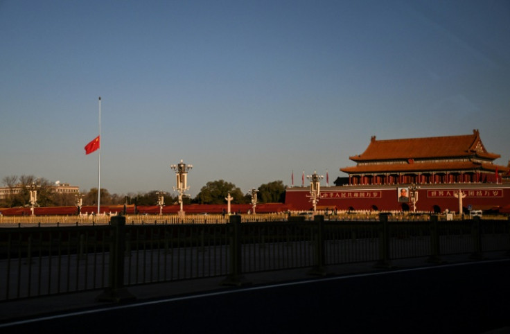The Chinese national flag flies at half-mast at Tiananmen Square in Beijing after the death of former leader Jiang Zemin