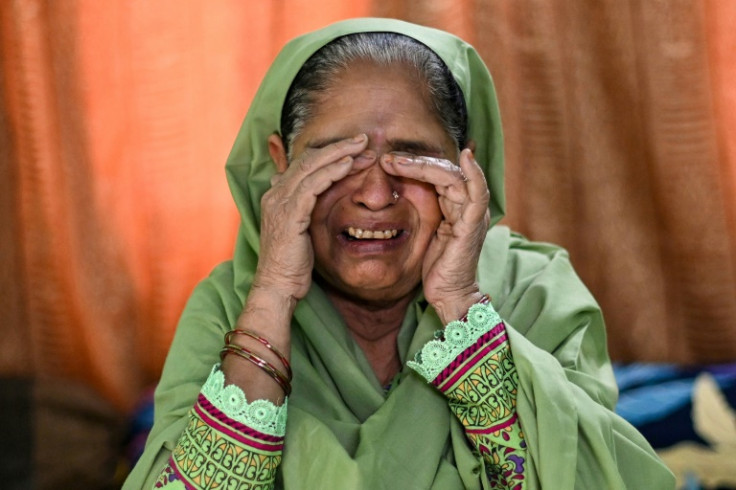 Asiya Begum, whose son died after undergoing a hair transplant procedure, breaks down as she speaks with an AFP reporter in New Delhi